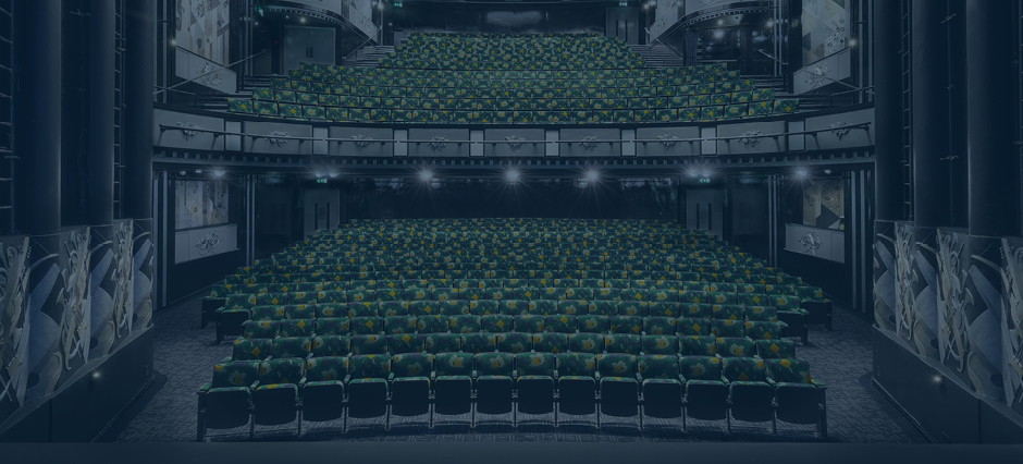 Blue tinted image of the auditorium of Trafalgar Theatre