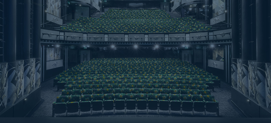 Blue tinted image of the auditorium of Trafalgar Theatre